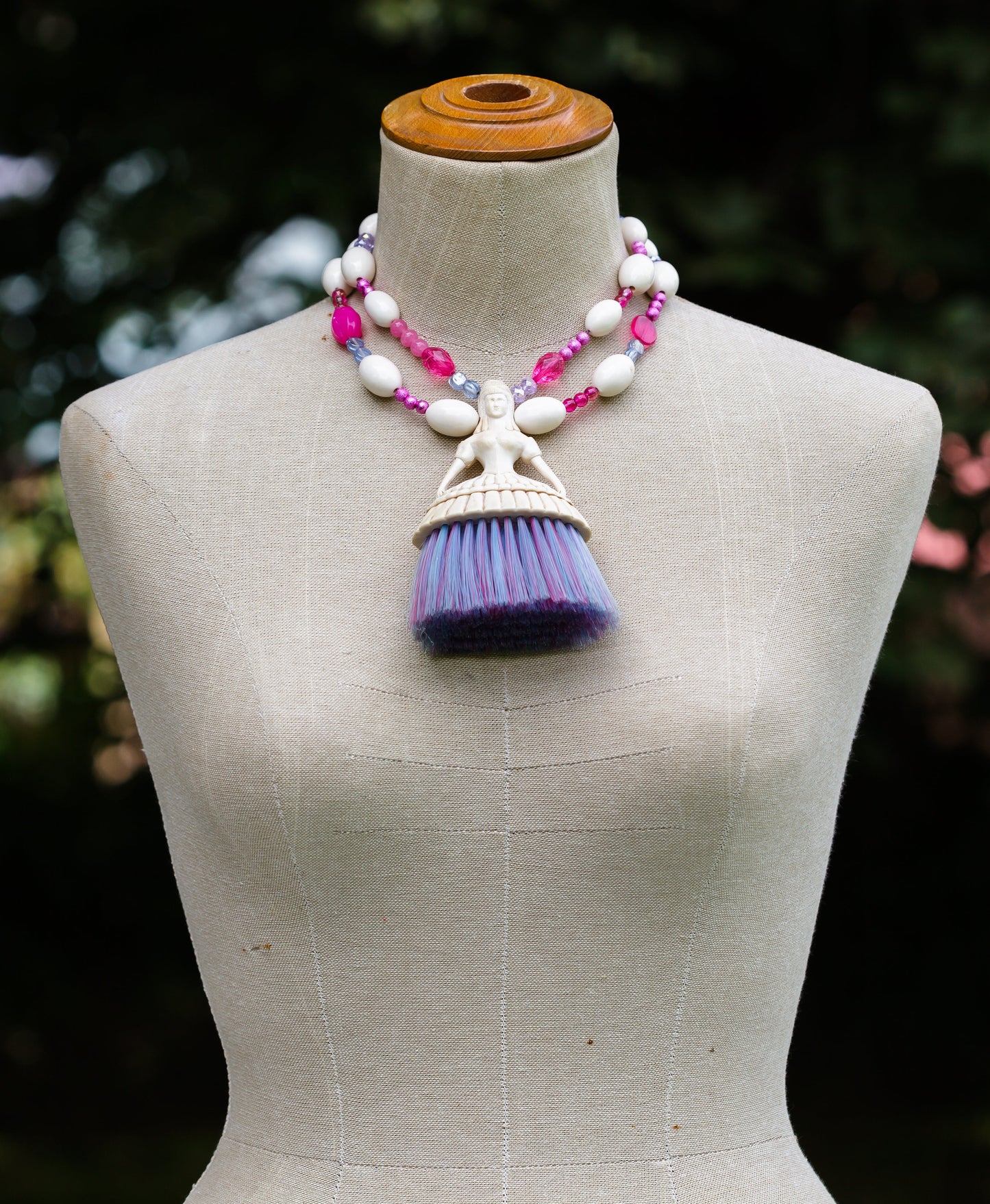 Vintage Plastic Figure with Brush Skirt on Pink and Cream Doublestranded Necklace | Hopetown & Hunter
