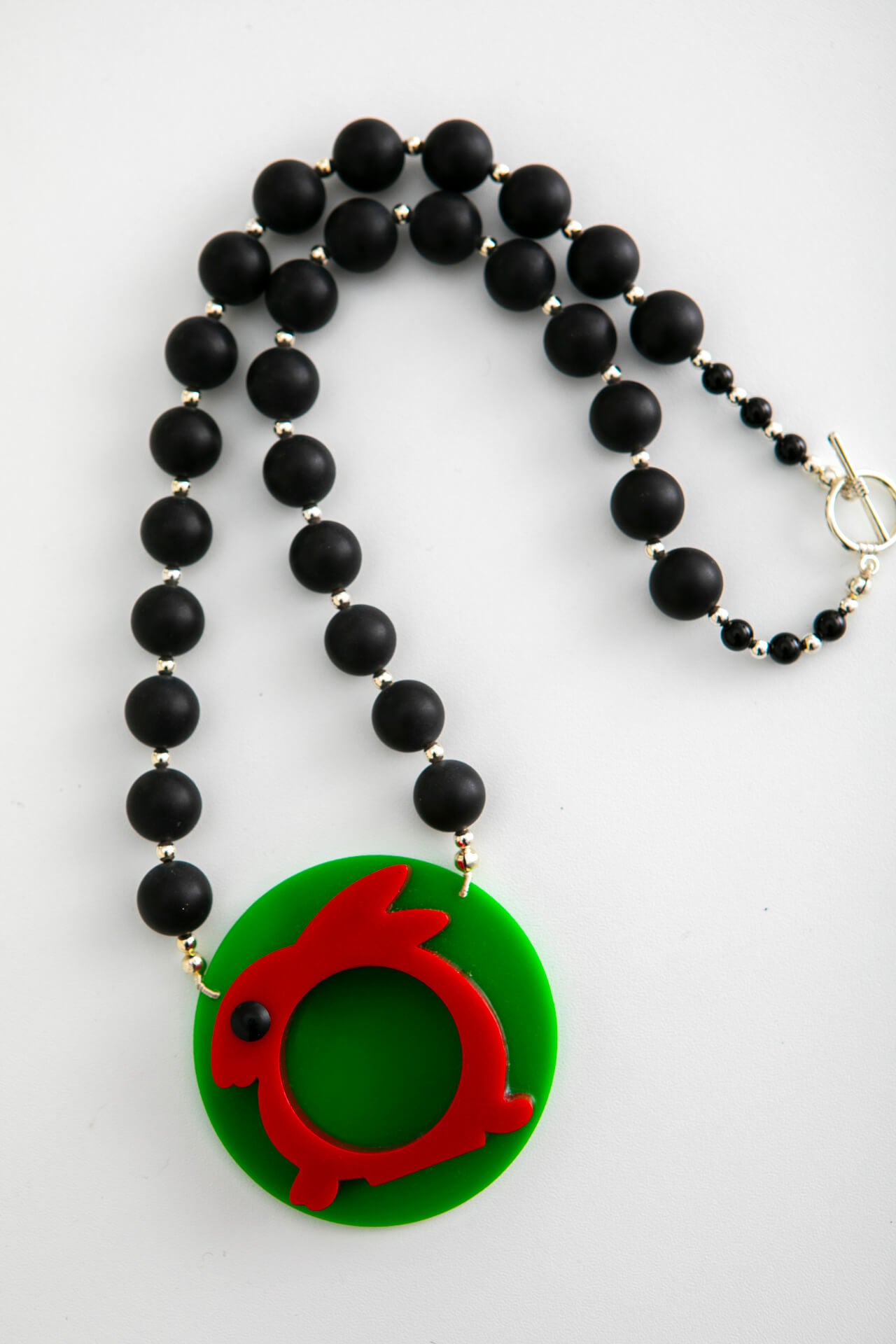 Round Red Rabbit Napkin Holder Necklace on Black Necklace