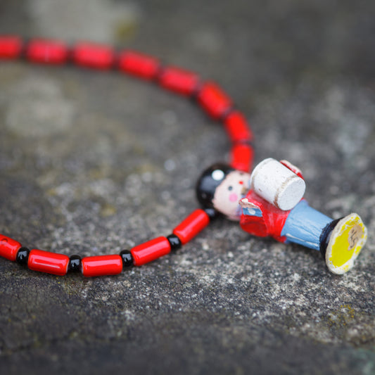 Tiny Military Drummer Figure on Red Necklace