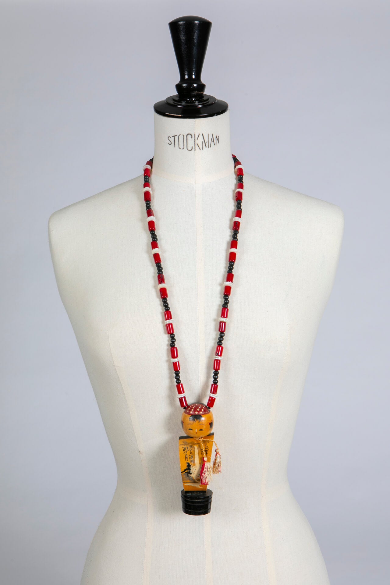 Vintage Kokeshi Doll on Long Coral Necklace